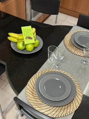 a table with plates of fruit and wine glasses at Prime Marina Location Stylish Apartment in Princess Tower in Dubai