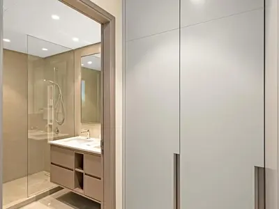 a bathroom with a sink and a shower at Grande Signature Burj Khalifa and Fountain View 2BD Apartment 35th Floor in Dubai