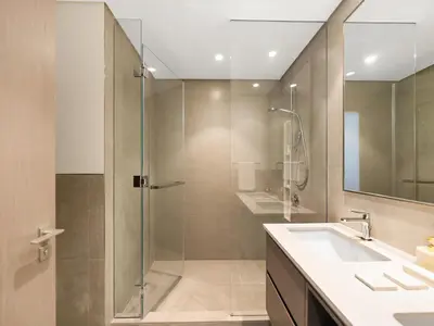 a bathroom with a shower and a sink at Grande Signature Burj Khalifa and Fountain View 2BD Apartment 35th Floor in Dubai