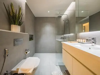 a bathroom with a toilet and a sink at TRPS - Ahad Residences, Business Bay - 1BR Luxurious Apartment - Massive Balcony with Pool View in Dubai