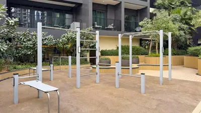 a playground in front of a building at TRPS - Ahad Residences, Business Bay - 1BR Luxurious Apartment - Massive Balcony with Pool View in Dubai
