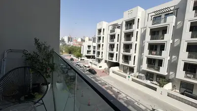 an apartment balcony with a view of a city street at Bespoke Holiday Homes - Stylish 1BR Penthouse in The Autograph in Dubai