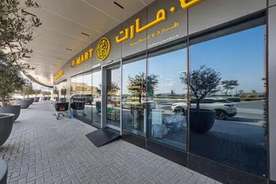 a store front of a dealership with glass windows at Contemporary 1BR Prime Location with Parking in Dubai