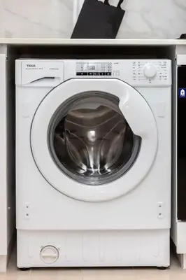 a white washing machine sitting in a room at Celestial View 1BR apartment in JVC in Dubai