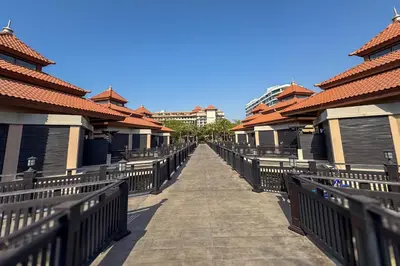 a walkway leading to a row of houses at Homely 1 Bedroom on Palm Jumeirah with private beach in Dubai