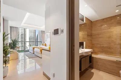 a bathroom with a tub and a sink in a room at LUX New Studio With 2 Double Beds in Downtown Dubai, Pool View, Free Parking in Dubai