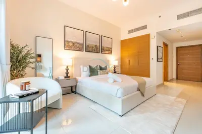 a bedroom with two beds and a desk at City View Studio, Minutes Away from Dubai Opera, Burj Khalifa and Dubai Mall, Claren Tower 2, Downtown Dubai by Deluxe Holiday Homes in Dubai
