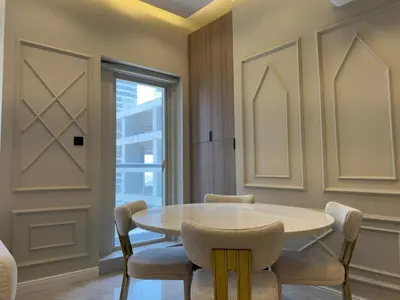 a dining room with a table and chairs at A unique luxury touch in JLT in Dubai