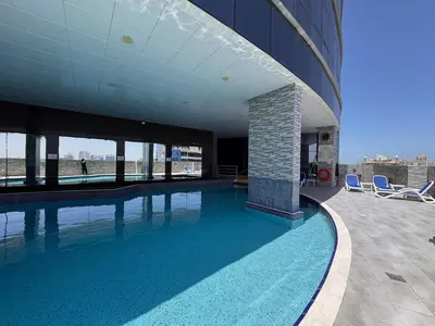 a swimming pool on the side of a building at A unique luxury touch in JLT in Dubai