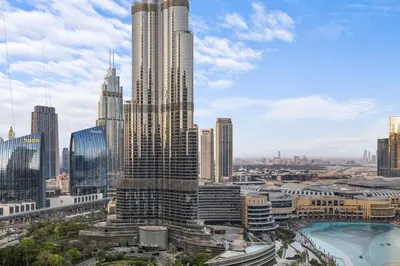 a view of a tall building in a city at Luxury Stay Just Steps from Dubai Mall 2BR Grande in Dubai