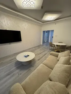 a living room with a couch and a table at Icon tower 1 , JLT 1BHK apartment in Dubai