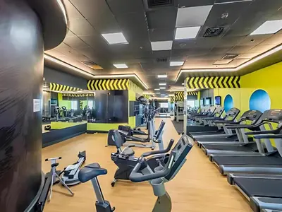 a gym with treadmills and elliptical machines at Stylish 2BR in Elite Tower with Bluewaters View and JBR in Dubai