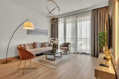 a living room with a couch and a table at Luxurious, Creek & Marina View in Dubai