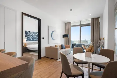 a living room with a couch and a table at The Marina Observatory-Jumeirah Living Marina Gate in Dubai