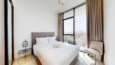 a hotel room with a bed and a window at Binghatti House - Two Bedroom with Private Pool in Dubai