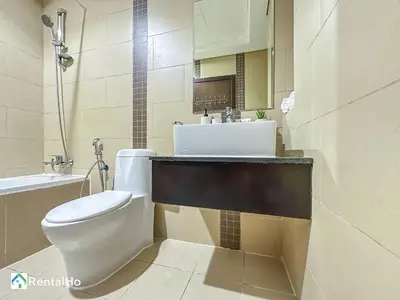 a bathroom with a white toilet and a sink at Amazing New Design Flat with Rooftop Pool in Dubai Marina 5 pax in Dubai