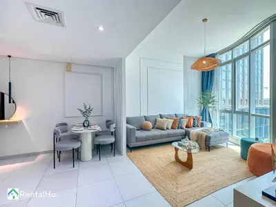 a living room with a couch and a table at Amazing New Design Flat with Rooftop Pool in Dubai Marina 5 pax in Dubai