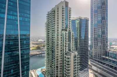 a view of a large city with tall buildings at 2BR Near Burj Khalifa & Business Bay Metro Station, Merano Tower, Business Bay in Dubai