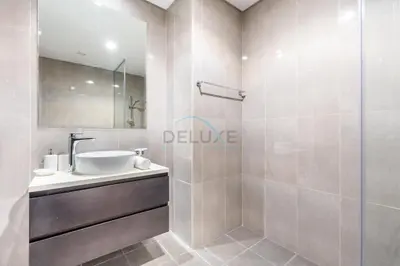 a bathroom with a sink and a shower at 2BR Near Burj Khalifa & Business Bay Metro Station, Merano Tower, Business Bay in Dubai