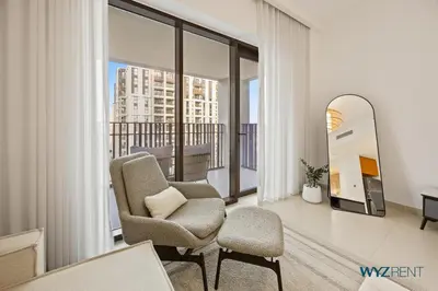 a living room with two chairs and a mirror at Urban Glam 1 BR in Surf 2-Creek Beach Access in Dubai