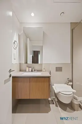 a bathroom with a sink and a toilet at Urban Glam 1 BR in Surf 2-Creek Beach Access in Dubai