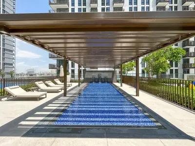 a large blue carpeted walkway in a building at Brand New Creek Home with Panoramic Water View in Dubai