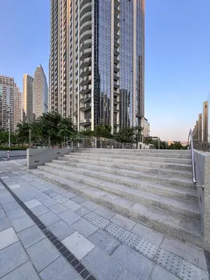 a group of stairs in a city with tall buildings at Full Burj Khalifa and Fountain View from All Rooms in Dubai