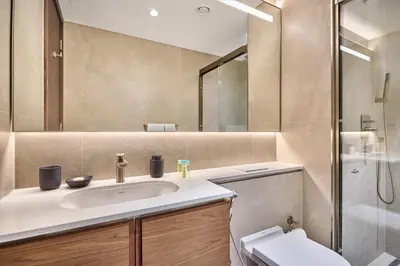 a bathroom with a sink and a shower at STAY BY LATINEM Luxury 1BR Holiday Home CVG 3204 Near Burj Khalifa in Dubai
