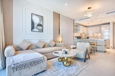 a living room with a couch and a table at STAY BY LATINEM Luxury 1BR Holiday Home CVG 3204 Near Burj Khalifa in Dubai