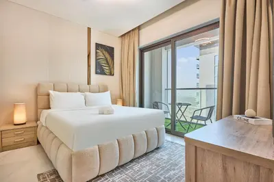 a hotel room with a bed and a balcony at STAY BY LATINEM Luxury 1BR Holiday Home CVG 3204 Near Burj Khalifa in Dubai