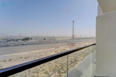 a view of a highway from a window at Bright & Luxury Studio with Balcony in Al Furjan in Dubai
