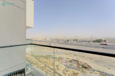 a view of a construction site from the glass floor of a building at Bright & Luxury Studio with Balcony in Al Furjan in Dubai