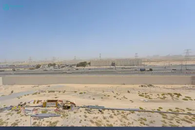 an aerial view of a construction site in the desert at Bright & Luxury Studio with Balcony in Al Furjan in Dubai