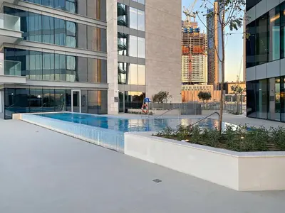 a swimming pool in the middle of a building at 2BR Canal Front B3, Waterfront Views in Dubai