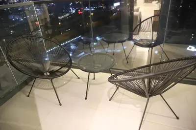 a group of chairs sitting in front of a window at Brand New Large 2 Bedroom with Burj Khalifa view in Dubai