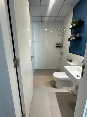 a bathroom with a shower and a toilet and a sink at The Nook 2 - 2 bed flat near Dubai Marina in Dubai