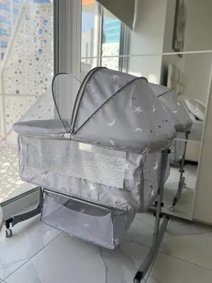 an open suitcase on a chair in a room at Luxury 1BR Apartment with Burj Khalifa&Canal view in Dubai