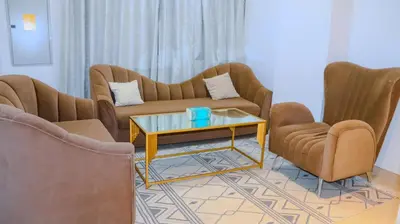 a living room with two couches and a coffee table at 1BHK Holiday Location in Dubai