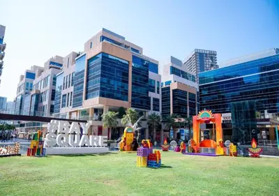 a park with a playground in front of a building at Bay Square studio Bay view in Dubai