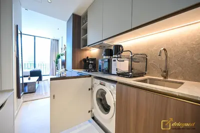 a kitchen with a sink and a washing machine at New Studio In Arjan by Deleguest in Dubai