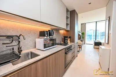 a kitchen with a sink and a microwave at Modern Studio in Arjan by Deleguest in Dubai