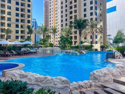a large swimming pool in a city with buildings at WonderfulStay at Marine Towers - Full Ain & Marina View - JBR Grande Living - Brand New Apartments in Dubai