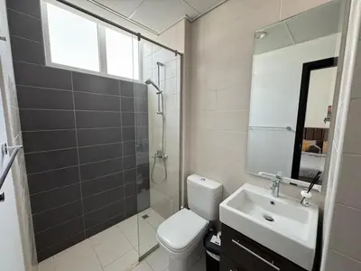a bathroom with a toilet and a sink and a mirror at 3 Bedroom Villa in Vardon Cluster Damac Hills 2 Peaceful Family Retreat By al sarya Holiday Homes in Dubai