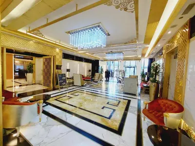 a lobby of a hotel with a glass floor at Damac Maison Mall Street! 2 Bedroom, 1-minute to Dubai Mall! in Dubai