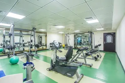a gym with treadmills and ellipticals in a room at Luxury Casa - Marina Diamond 2 in Dubai