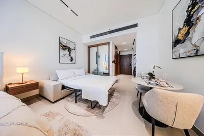 a bedroom with a bed and a table and chairs at Trillionaire Business Bay with Private Jacuzzi in Dubai