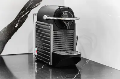 a toaster sitting on a table next to a tree at Trillionaire Business Bay with Private Jacuzzi in Dubai