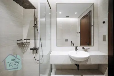a bathroom with a sink and a shower at Luxurious - Comfy 2BR in Business Bay - City Views in Dubai