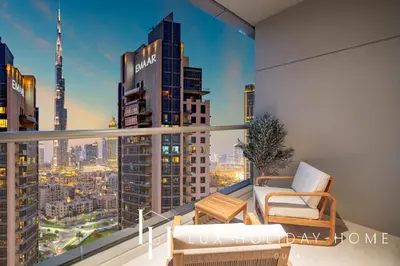 a balcony with a view of a city skyline at LUX The Burj Khalifa Downtown View Studio 2 in Dubai