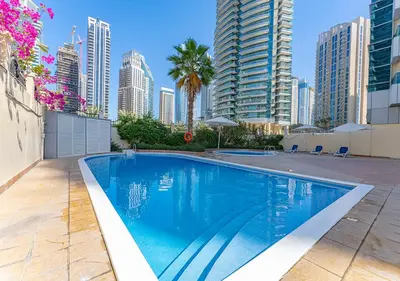 a swimming pool in a city with tall buildings at 1BR Elegant Apartment in Marina Diamond 3 Metro Access in Dubai